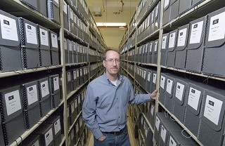 Lead archivist Steve Mielke surrounded by more than 1,000 boxes of Norman Mailer material
