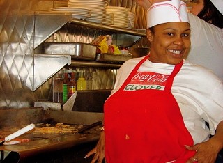 Clover Grill's Sheika will delight and amaze with her fascinating skillz on the grillz... while dancing.
