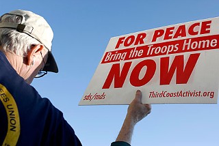 Anti-war activists turned out Monday evening at Sixth and Lamar to draw attention to the 4,000 U.S. men and women who have died in the Iraq war.