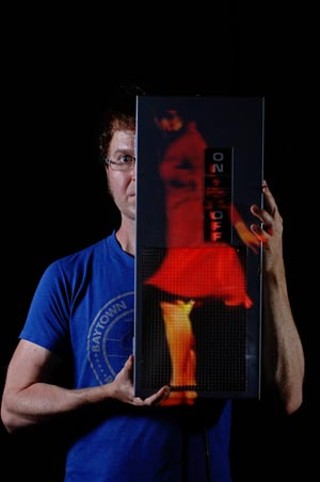 Fuse Box guru Ron Berry with a projected image of festival artist Andee Scott