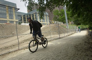 A cyclist takes advantage of the reopened hike and bike trail between Shoal Creek and Congress Avenue. Construction had closed the trail as part of a two-way traffic conversion project along Cesar Chavez.