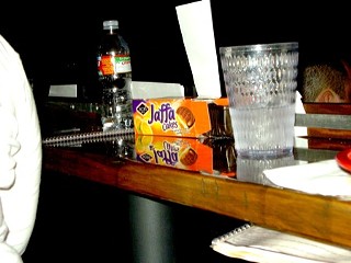 My neighbors to the left brought series-related Jaffa Cakes, which Simon and Edgar later passed around the crowd. This, sadly, is the only in-focus picture I have of the whole night.