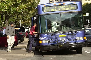 Riders board a Capital Metro bus on a route operated by the agency's main contractor, StarTran; next year, two other contractors will carry some of the load for less money.