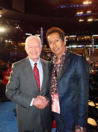 Former President Jimmy Carter and Alejandro Escovedo (r)