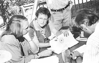 Erin Foster (center) leads a meeting of the Hays County Water Planning Partnership
