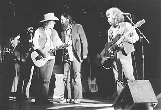 Doug Sahm confers with Roky Erickson as Freddy Fender looks on, Austin Music Awards, 1990-91.