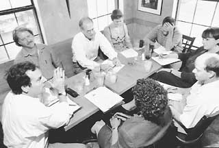 Talking about the convolution (clockwise from left): Ben Heimsath, Mark Rogers, Charles Heimsath, Clare Barry, Mike Clark-Madison, Tere O'Connell, Bob Paterson, and Bernice Butler