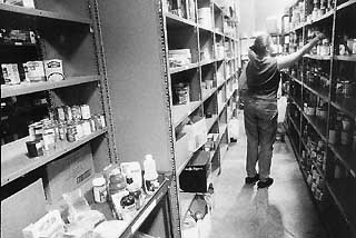 Caritas volunteer Shannon Mann fills an order.