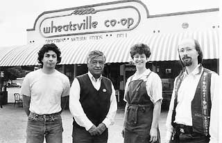 Kip Garth, Cesar Chavez, Marie Caesar, and Danny Poe at Wheatsville Co-op in 1990