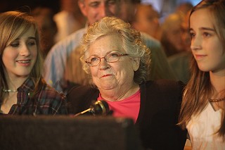 Flanked by two of her granddaughters, Carole Strayhorn acknowledges her defeat.