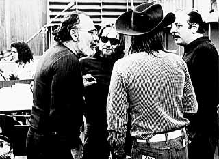 Wexler confers with Willie Nelson (sunglasses) and Arif Mardin (r).