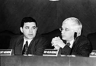 State Reps. Henry Cuellar, D-Laredo, and Scott Hochberg, D-Houston, discuss the state of higher education in Texas at a House committee meeting Monday.