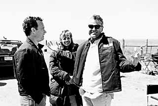 This movie begins and ends in Texas, says Broyles, here with his wife Andrea and Hanks in Canadian, Texas, where <i>Cast Away</i>'s bookend scenes were shot. And that's no accident. This is where my heart is.<br>(photo courtesy Bill Broyles)