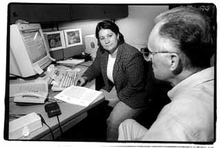 Susan Hendrix consults with a laid-off Motorola employee. Some older professionals say they don't fit in with Austin's high-tech scene.