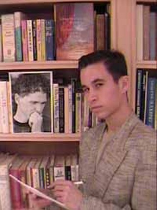 Gary Baum in front of a photo of Dave Eggers, his vessel.