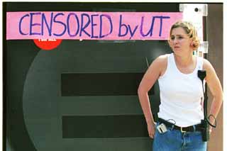 Liz Furbush, UT freshman and Justice for All treasurer, stands in front of the anti-abortion display sponsored by the group.