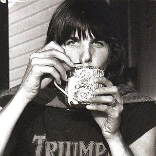 Look at him here, giggles Polly Parsons. He's wearing a cape! And a Triumph motorcycle T-shirt, smoking pot through a mug, and wearing my mother's promise ring.