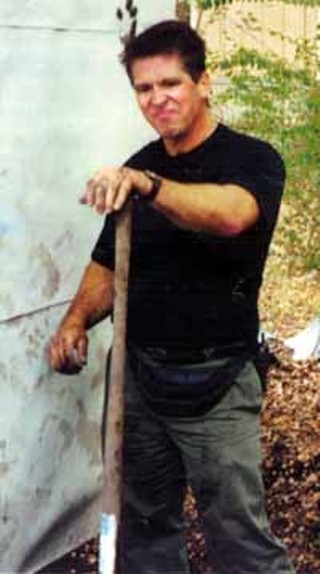 FCC agent Loyd Perry proceeds with the FRA raid.<br><i>Photo courtesy Free Radio Austin</i>