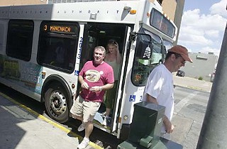 Pub crawlers hop off the bus Downtown.