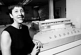 Judith Sims with proposed model of Austin Museum of Art