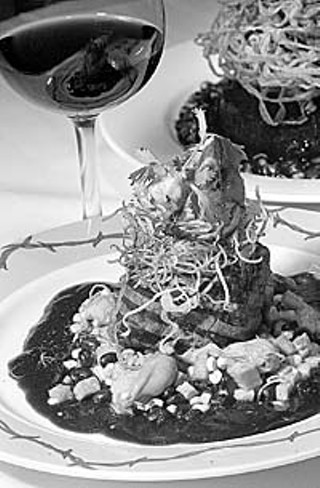 Pecan grilled beef tenderloin with a Tuaca habanero demi smoked oyster sweet potato hash topped off with an achiote shrimp cocktail