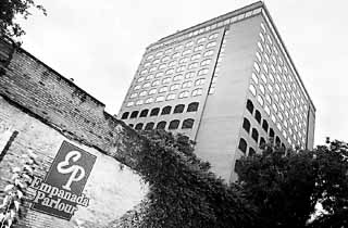 The Sheraton Austin Hotel rising over the neighborhood.