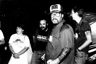 Hearts and flowers: Soon-to-be spouses Margaret Moser (left) and Rollo Banks (foreground) with Louis Black and Michael Corcoran