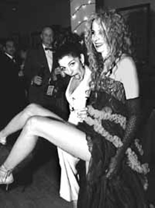 Left: Austin's beauty dynasty headed by brothers Roy Fredericks of Avant (second from right) and Ron Fredericks of Innu (right) at the Jingle Ball. Right: Party girls (l-r) Laura Cisneros and Gail Chovan kick it up at the Jingle Ball.
