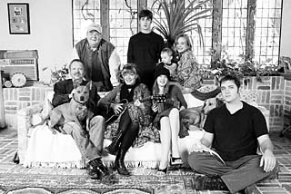 Front row (l-r): Joe Gracey, Kimmie Rhodes, Jole Gracey, and Jeremy Rhodes; back row: Joe Sears, Gabe Rhodes, Louis Rhodes, Jamie Rhodes; dogs: Rosa and Bonnie; lizard: Darwin