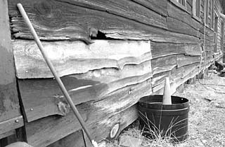 Never enough money: Cabins at Bastrop State Park, with cracked masonry, sagging foundations, and rotten paneling illustrate TPW's funding needs.