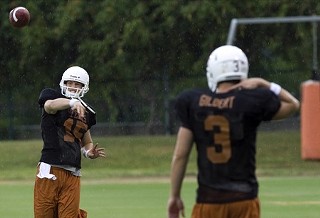 Trevor Walker (l) warms up his fourth-string arm