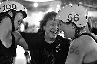It's a family affair: Crackerjack (100) and her sister Lucille Brawl (56) celebrate with their mother, known in derby circles as Gigi String.