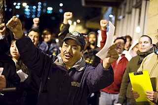 A crowd that included construction workers and their families turned out Dec. 16 for a vigil in memory of three workers who died as a result of a scaffolding accident at a West Campus apartment project.