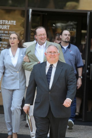 Yogurt shop defendants Michael Scott and Robert Springsteen leave the Travis County Jail.