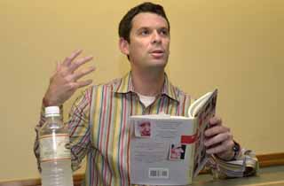 Mark Jude Poirier's reading at BookPeople on May 23 was a deceptively traditional one. Sure, Poirier lives and works part of the year in Archer City, counting Larry McMurtry as his friend and fellow resident, but his fiction defies geographical genre. It is dizzyingly original, a sort of sit-down comedy, sometimes subtle, sometimes flagrant. Poirier excerpted two stories from his new <i>Unsung Heroes of American Industry</i> (Talk Miramax, $22) on this night, Buttons and Pageantry, and the 20-plus audience was stuck in constant giggle, with occasional laughing-cum-coughing fits in between.