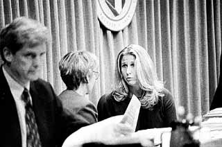 Futrell on the City Council dais in 1999, talking with then-Council Member Beverly Griffith. Former Council Member Bill Spelman is in the foreground.