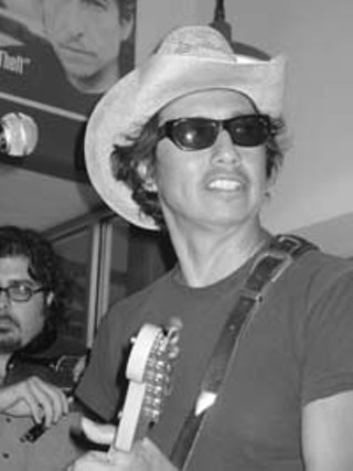 A lot of these songs were probably written while I was working here, waves Escovedo at Waterloo's front counter, ... while I was on the clock.