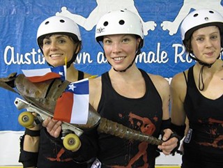The Angie-Christ (center) holds the Governor's Cup (technically an iron armadillo)