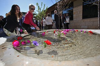 Cecile Richards (r), president of the Planned Parenthood Federation of America, joins in the March 25 dedication of a fountain in the courtyard of the Robbie and Tom Ausley Clinic and Education Center in South Austin. The fountain was named for Richards' mother, the late Gov. Ann Richards, a lifelong advocate of Planned Parenthood.