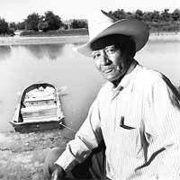 Photo of Olivas and his boat